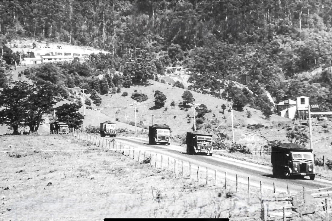 Coal trucks descending the haul road from the Huntley Colliery